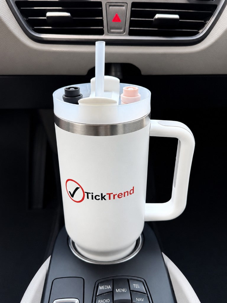 TickTrend 40 oz white insulated tumbler with handle in a vehicle cup holder