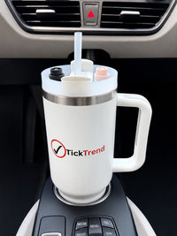 TickTrend 40 oz white insulated tumbler with handle in a vehicle cup holder