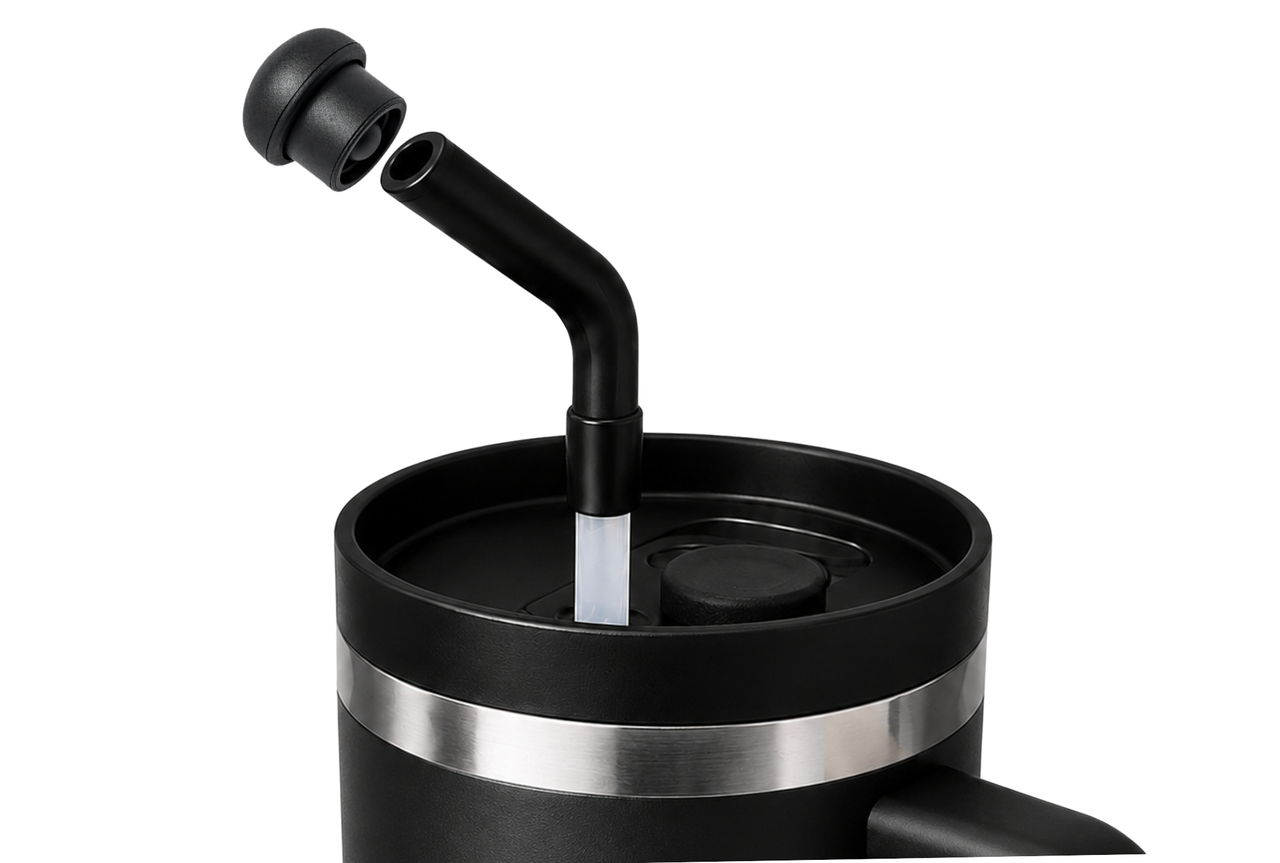 Black magnetic silicone straw cap positioned above a black tumbler straw, showing how the reusable cap fits compatible 10-12 mm straw openings.
