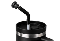Black magnetic silicone straw cap positioned above a black tumbler straw, showing how the reusable cap fits compatible 10-12 mm straw openings.
