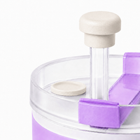 Close-up of a pearl white magnetic silicone straw cap on a tumbler straw with matching reusable straw cover base