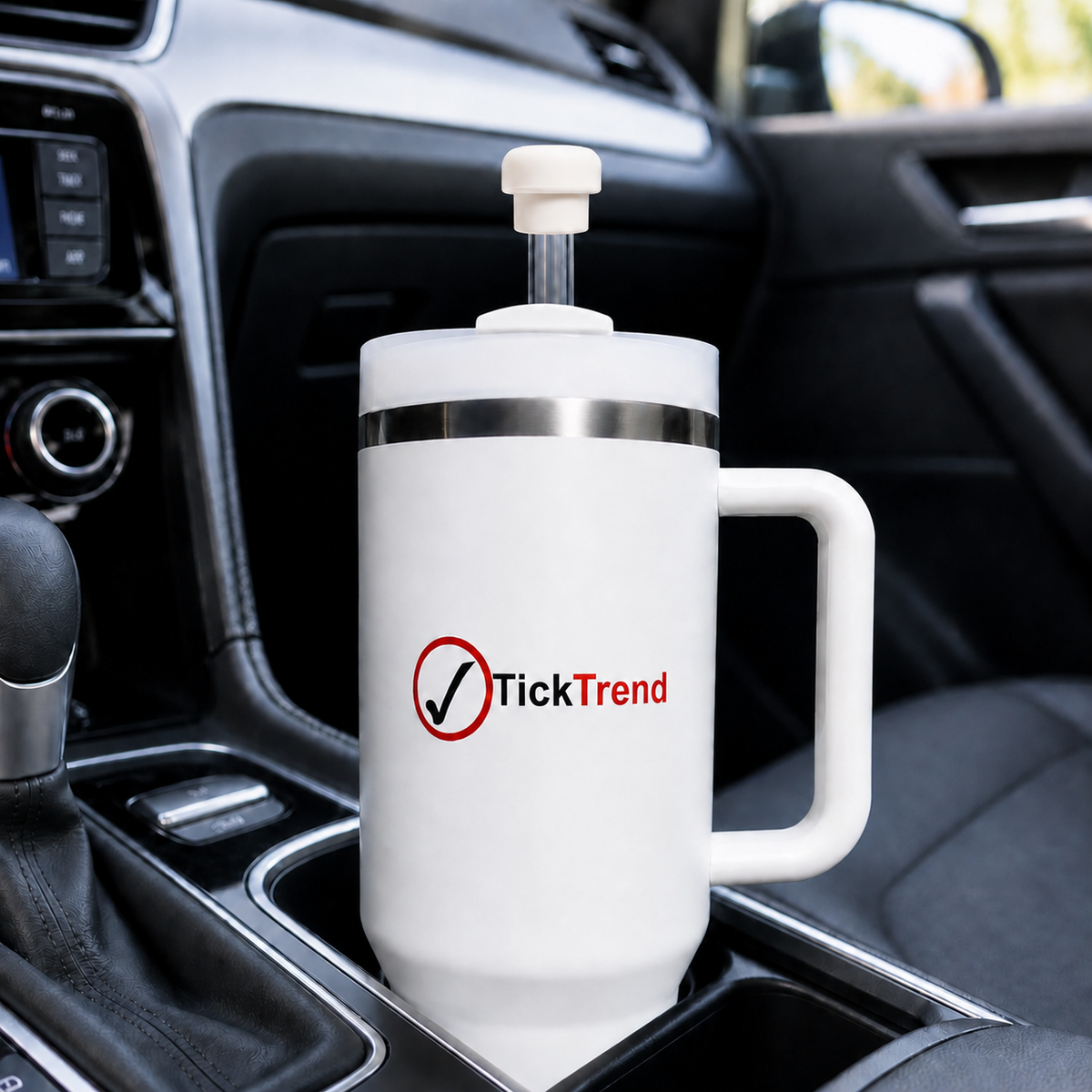 Pearl white magnetic silicone straw cap on a travel tumbler, used as a reusable straw cover