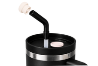 Pearl white magnetic silicone straw cap on a tumbler straw, shown as a reusable straw cover