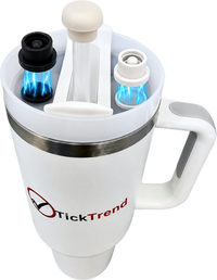 Pearl white and black magnetic silicone straw cover caps shown on clear reusable straws above a white TickTrend handled tumbler with a transparent background.