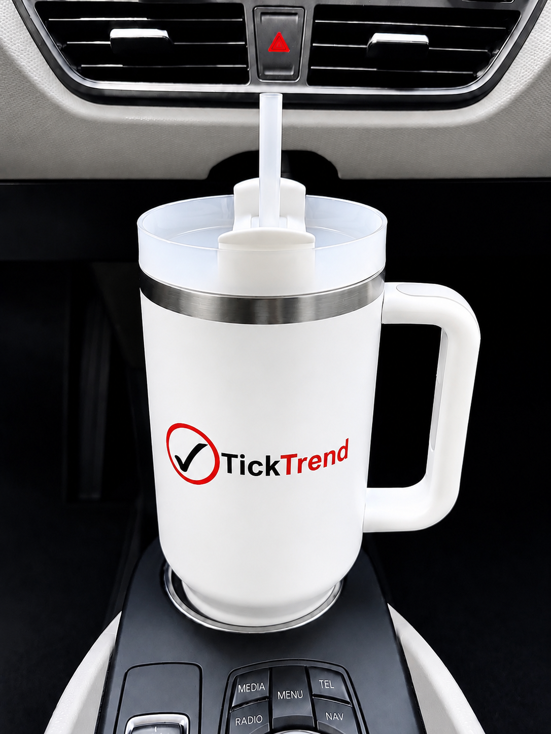 TickTrend 40 oz white insulated tumbler with handle in a vehicle cup holder