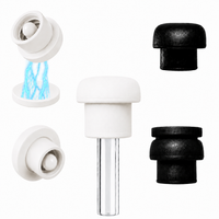 Close-up display of pearl white and black magnetic silicone straw cover caps with internal magnet components and a clear reusable straw, showing the silicone construction and compatibility with most 10–12mm reusable straws for tumblers and water bottles.