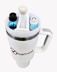 Magnetic silicone straw cover caps on a 40oz handled tumbler, showing black and pearl white straw protectors with magnetic attachment for dust and spill protection.